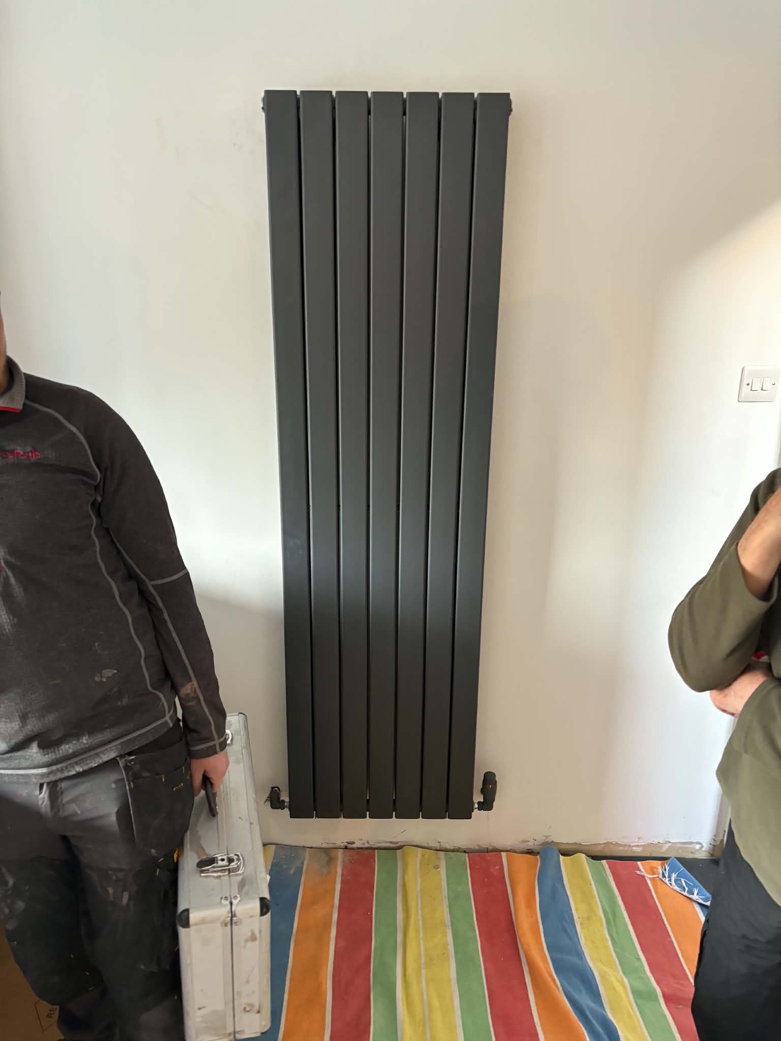 Vertical anthracite designer radiator installed by Heat2O Northeast in Gateshead